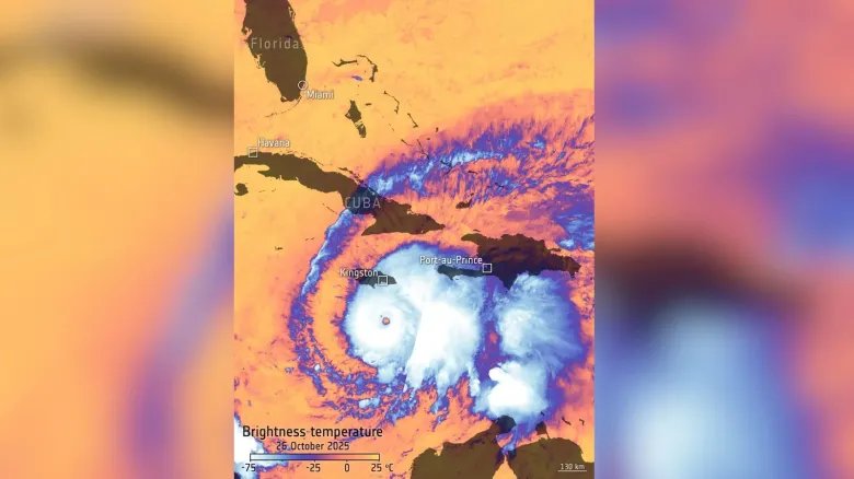 A bright orange and pink and purple map showing various temperatures corresponding to various colors over an image of Hurricane Melissa with Cuba and Florida labeled
