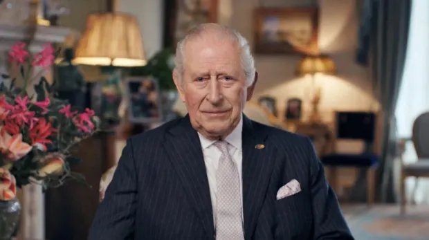 King Charles III says hell scale back cancer treatment thanks to early diagnosis Britain039s King Charles speaks about his cancer recovery during a prerecorded message filmed in The Morning Room at Clarence House in London in this handout image released Dec 12 2025